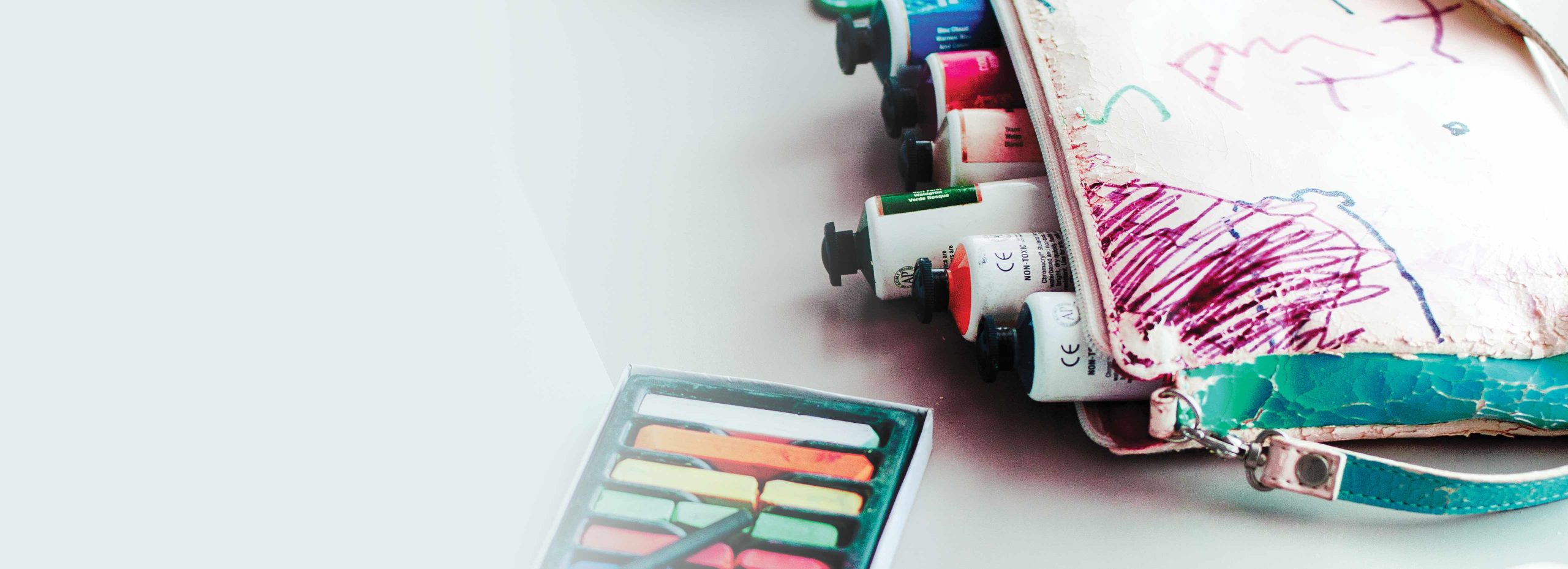 Pastels and acrylic paint tubes