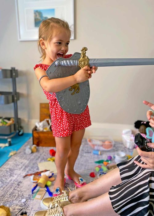 Young girl with toy sword